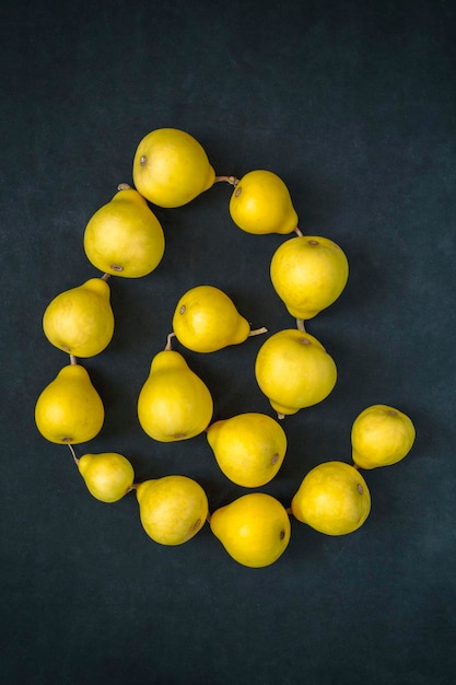 Still life with pearshaped yellow decorative pumpkins