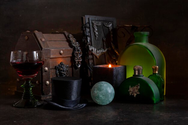 still life with semiprecious stone black candle mystical magical attributes concept for halloween