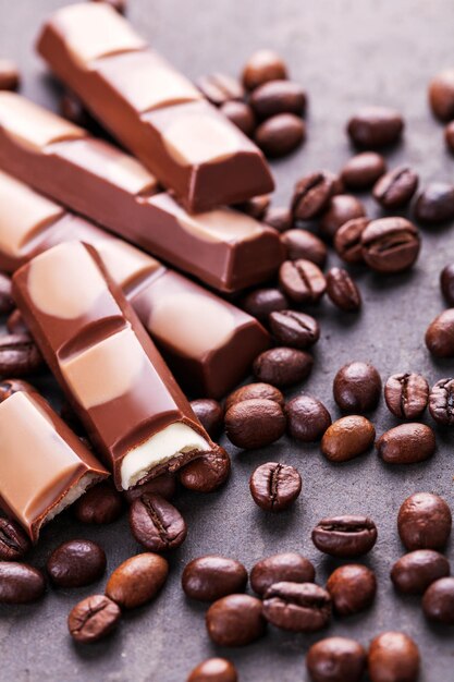 Still life with set of chocolate with coffee grains closeup