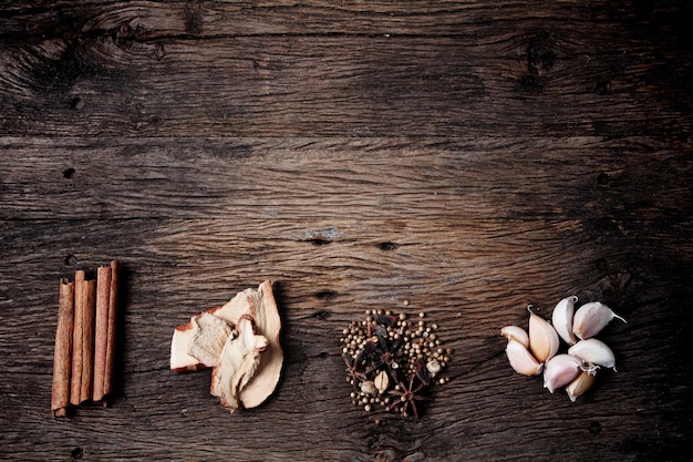 Photo still life with spices on old wooden table