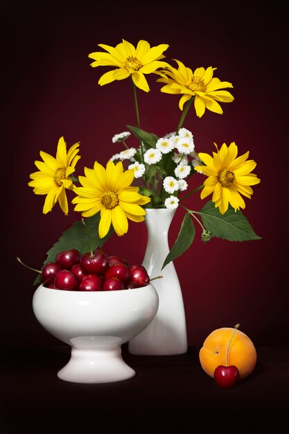 Still life with a summer bouquet with yellow and white flowers