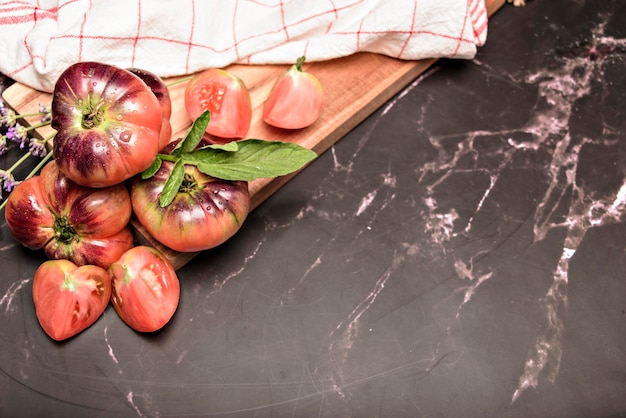 Still life with tiger tomato on wood table