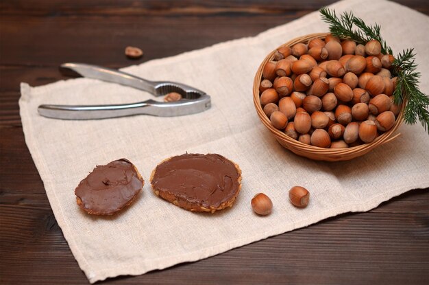 Still life with toasts with chocolate cream and hazelnuts