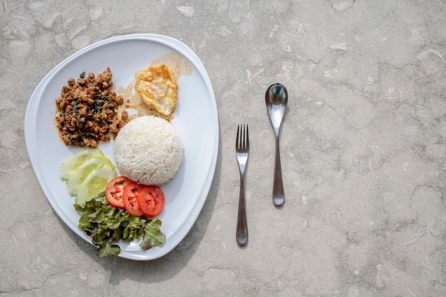 Photo stir fried basil with rice and fried egg traditional thai food