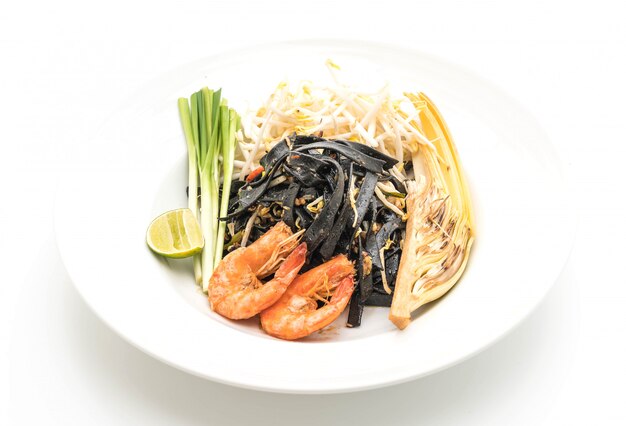 stir-fried black spaghetti with shrimp (pad thai) - fusion food