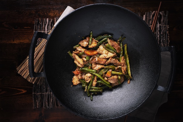 Stir fried chicken in cast iron wok