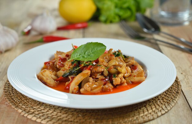 Photo stir fried chicken with holy basil and hot chilli