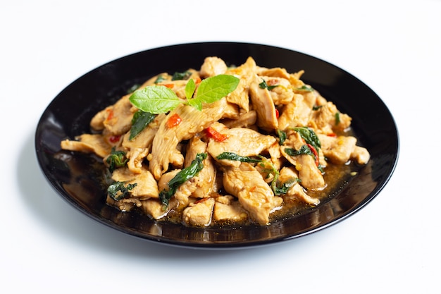 Stir-fried chicken with holy basil on white 