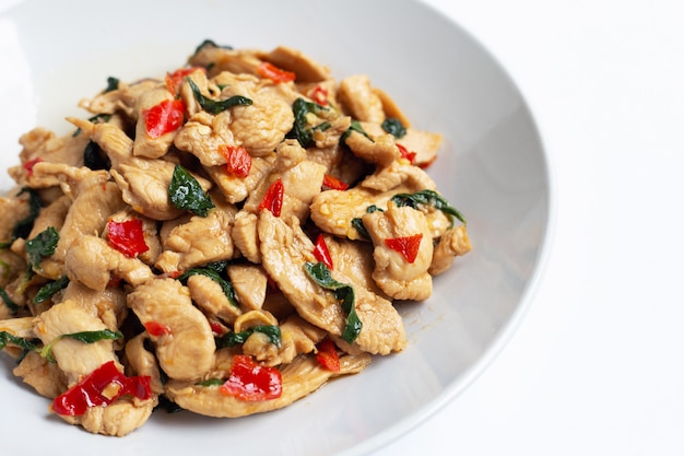 Stir-fried chicken with holy basil on white 