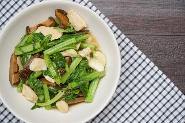 Stir fried chinese spinach with chicken and shiitake mushroom.