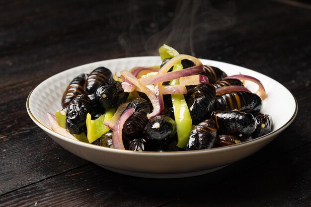 Stir-fried cocoon pupae is a special food in northeast China