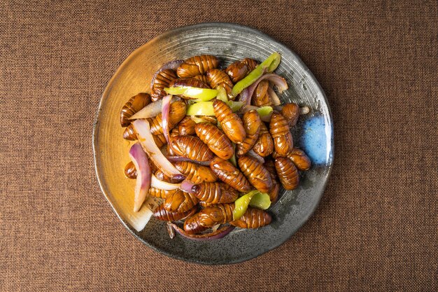 Stir-fried cocoon pupae is a special food in northeast China