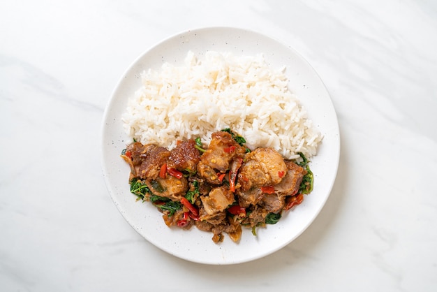 stir-fried crispy pork belly and basil with rice - Asian local street food style