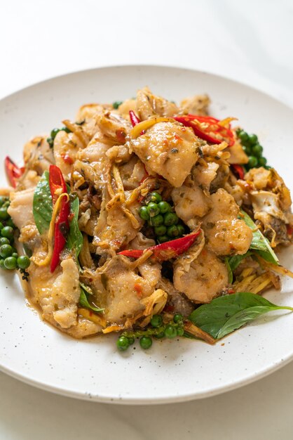 stir fried holy basil with fish and herb - Asian food style