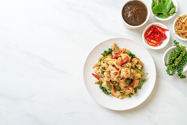 stir-fried holy basil with fish and herb