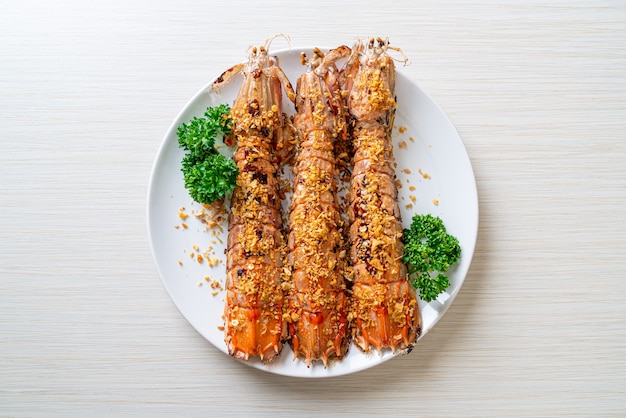 stir-fried Mantis Shrimp with Garlic on white plate