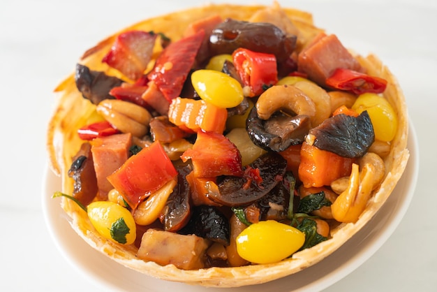 Stir fried mixed Chinese fruits 
and nuts - Asian food style