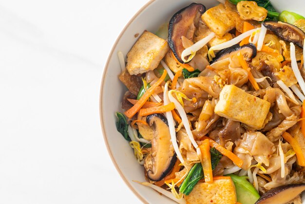 stir-fried noodles with tofu and vegetables - vegan and vegetarian food style