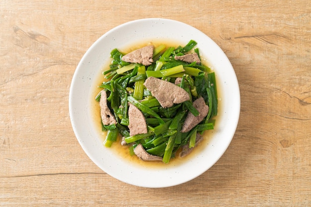 Stir-fried onion flower stem with pork liver - Asian food style