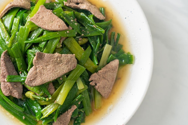 Stir-fried onion flower stem with pork liver - Asian food style