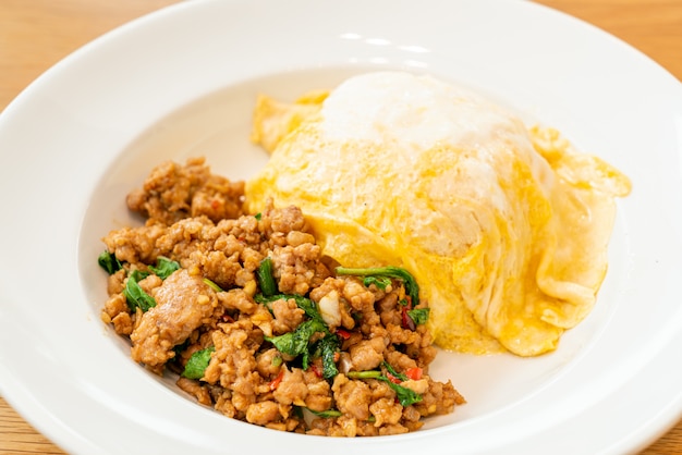 stir-fried pork and basil with creamy omelet on rice  - asian food style