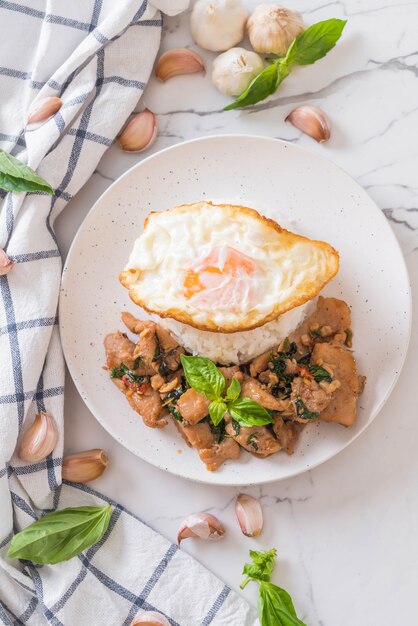 stir-fried pork with basil  on rice and fried egg