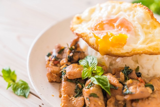 stir-fried pork with basil  on rice and fried egg