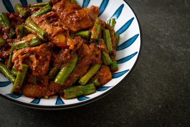 Stir fried pork with red curry paste - Thai food style