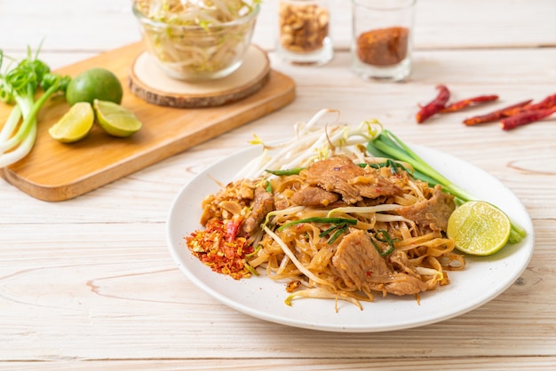 stir-fried rice noodles with pork in Asian style