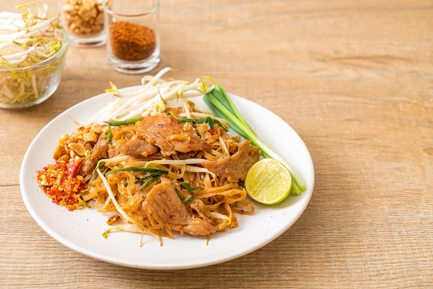 stir-fried rice noodles with pork in Asian style