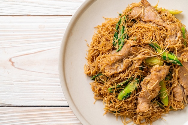 Stir fried rice vermicelli noodle with black soy sauce and pork - Asian food style