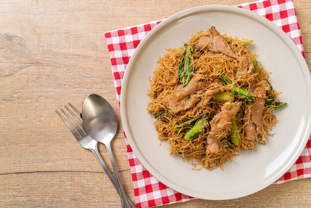 Stir fried rice vermicelli noodle with black soy sauce and pork - asian food style