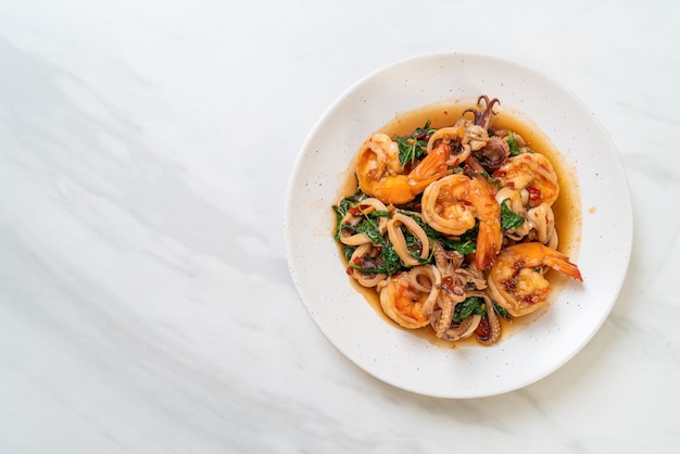 stir-fried seafood (shrimps and squid) with Thai basil - Asian food style