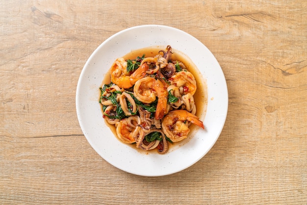 stir-fried seafood (shrimps and squid) with Thai basil