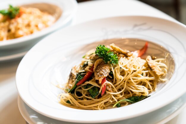 Stir fried spaghetti and dried Gourami