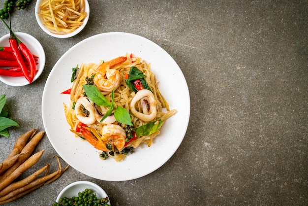 stir fried spicy noodles with sea food (Pad Cha Talay) - Thai food style