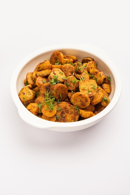 Stir fried taro roots Arbi ki sabji ghuiya masala curry Sabzi or arvi dum Masala Garnished with coriander