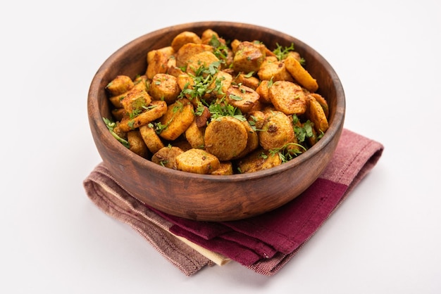 stir fried taro roots arbi ki sabji ghuiya masala curry sabzi or arvi dum masala garnished with coriander