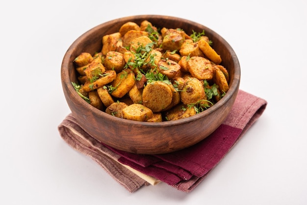 Stir fried taro roots Arbi ki sabji ghuiya masala curry Sabzi or arvi dum Masala Garnished with coriander