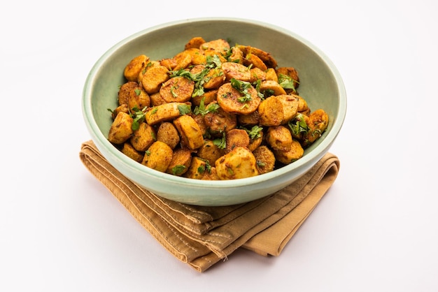 stir fried taro roots arbi ki sabji ghuiya masala curry sabzi or arvi dum masala garnished with coriander