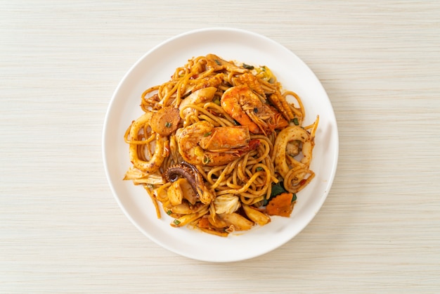 stir fried Tom Yum seafood dried spaghetti - Fusion food style