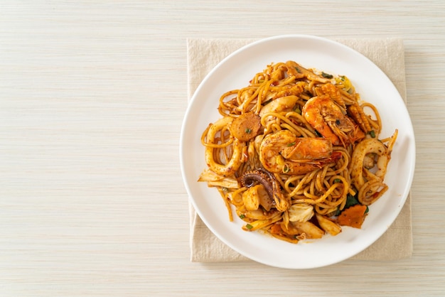 stir fried Tom Yum seafood dried spaghetti - Fusion food style