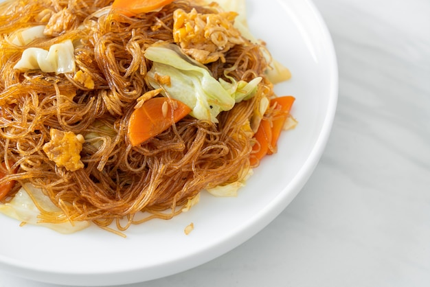 stir fried vermicelli with cabbage, carrot and egg - vegan food style