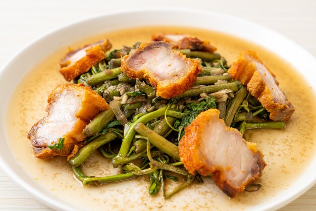 Stir-fried water mimosa with crispy pork belly