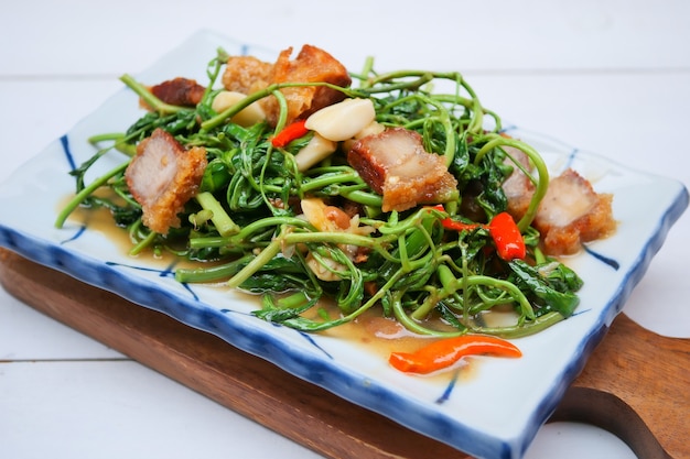 Photo stir-fried water mimosa with crispy pork