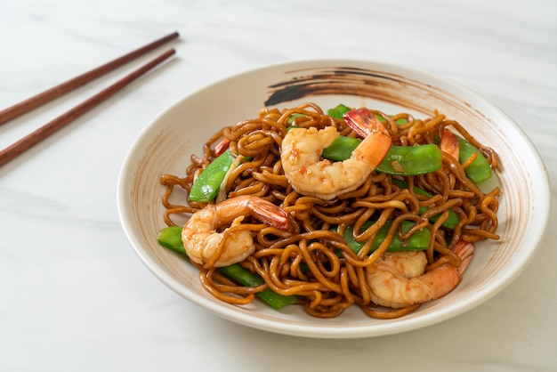 stir-fried yakisoba noodles with green peas and shrimps - Asian food style