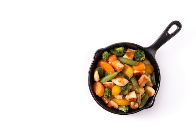 Stir fry chicken with vegetables on an iron pan