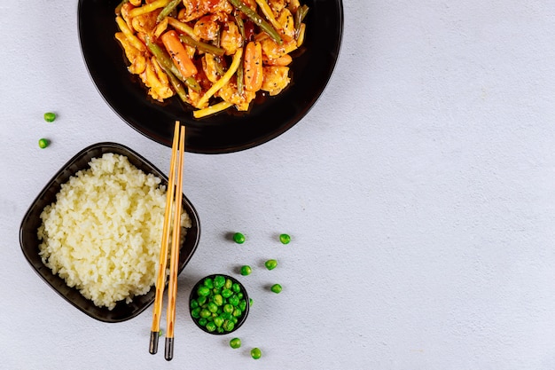 Stir fry vegetables with chicken and rice