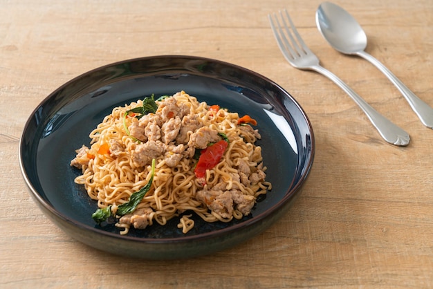 Stirfried instant noodles with basil and minced pork