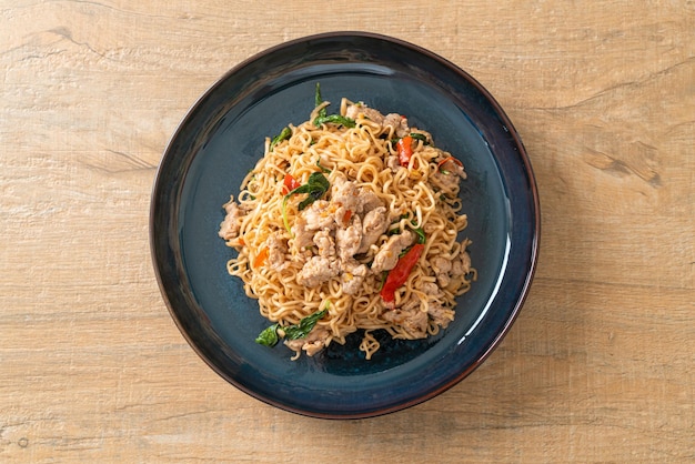 Stirfried instant noodles with basil and minced pork